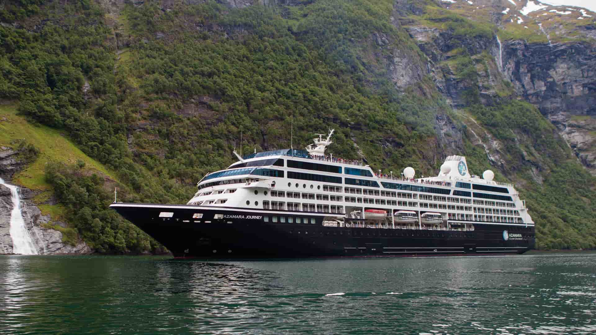 Azamara Journey sailing in a misty, European fjord.