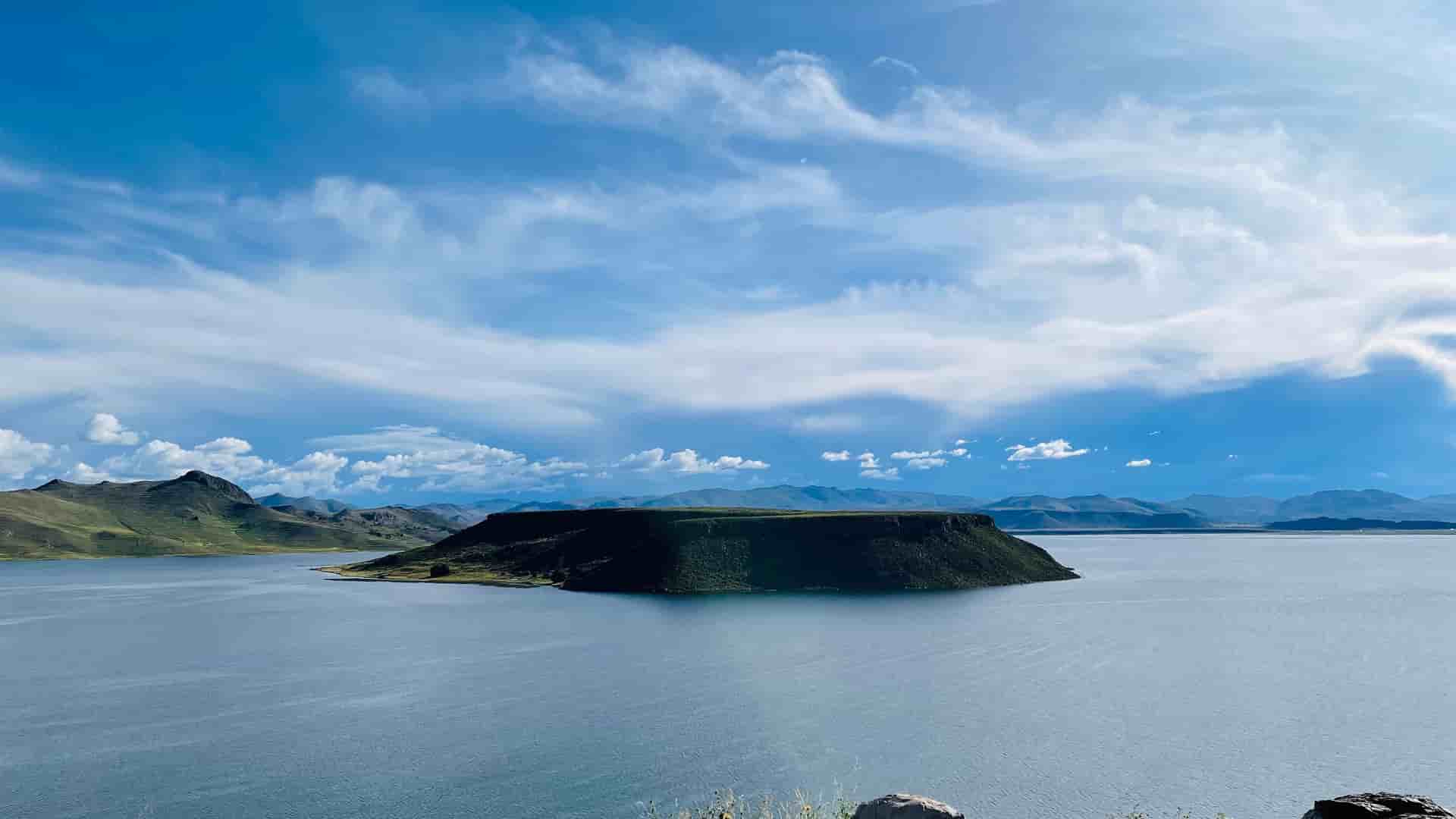 "A stunning wide shot of the volcanic island of Inka T'aqana, or ""Inca's staircase"", in the center of Lake Titicaca near Juliaca, Peru.  "