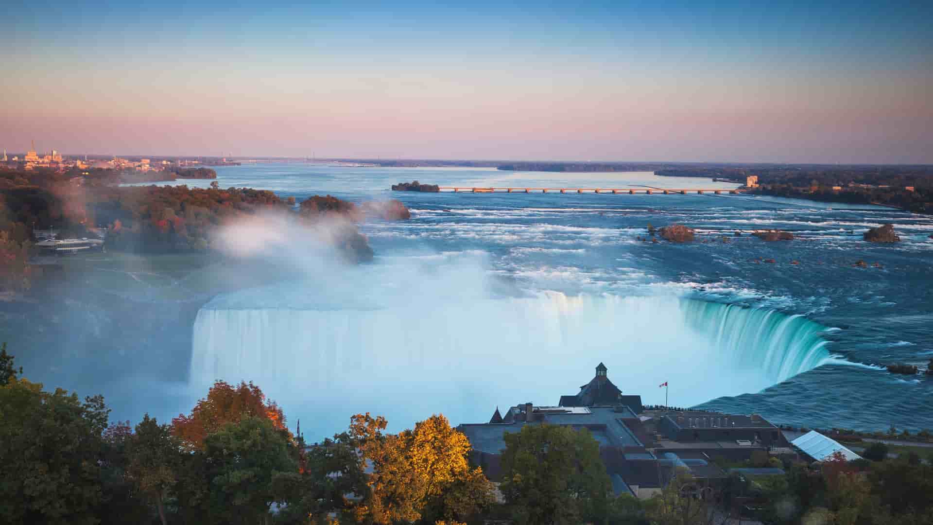 "A beautiful sunset panoramic view of the majestic Horseshoe Falls and the Niagara River from the Ontario, Canada side.  "