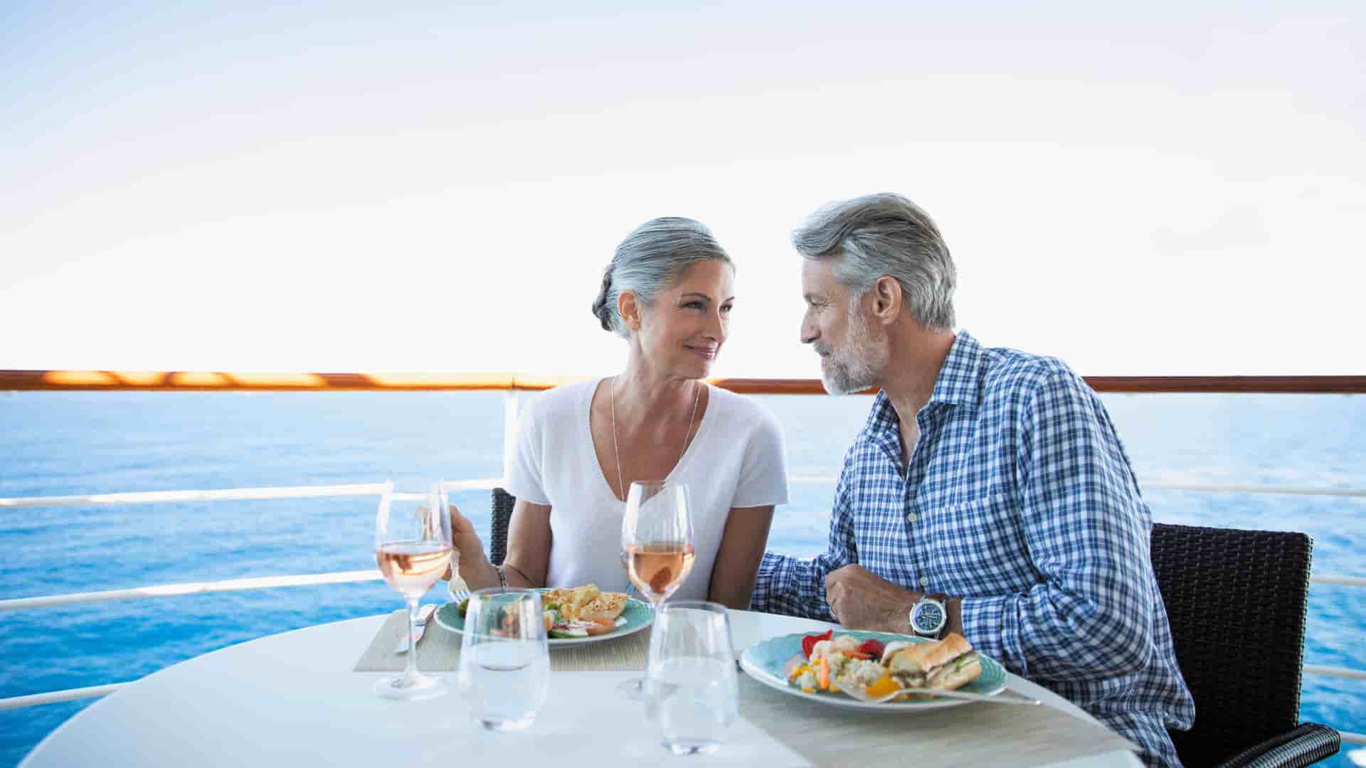 A couple dining at La Veranda on a Regent Seven Seas cruise.