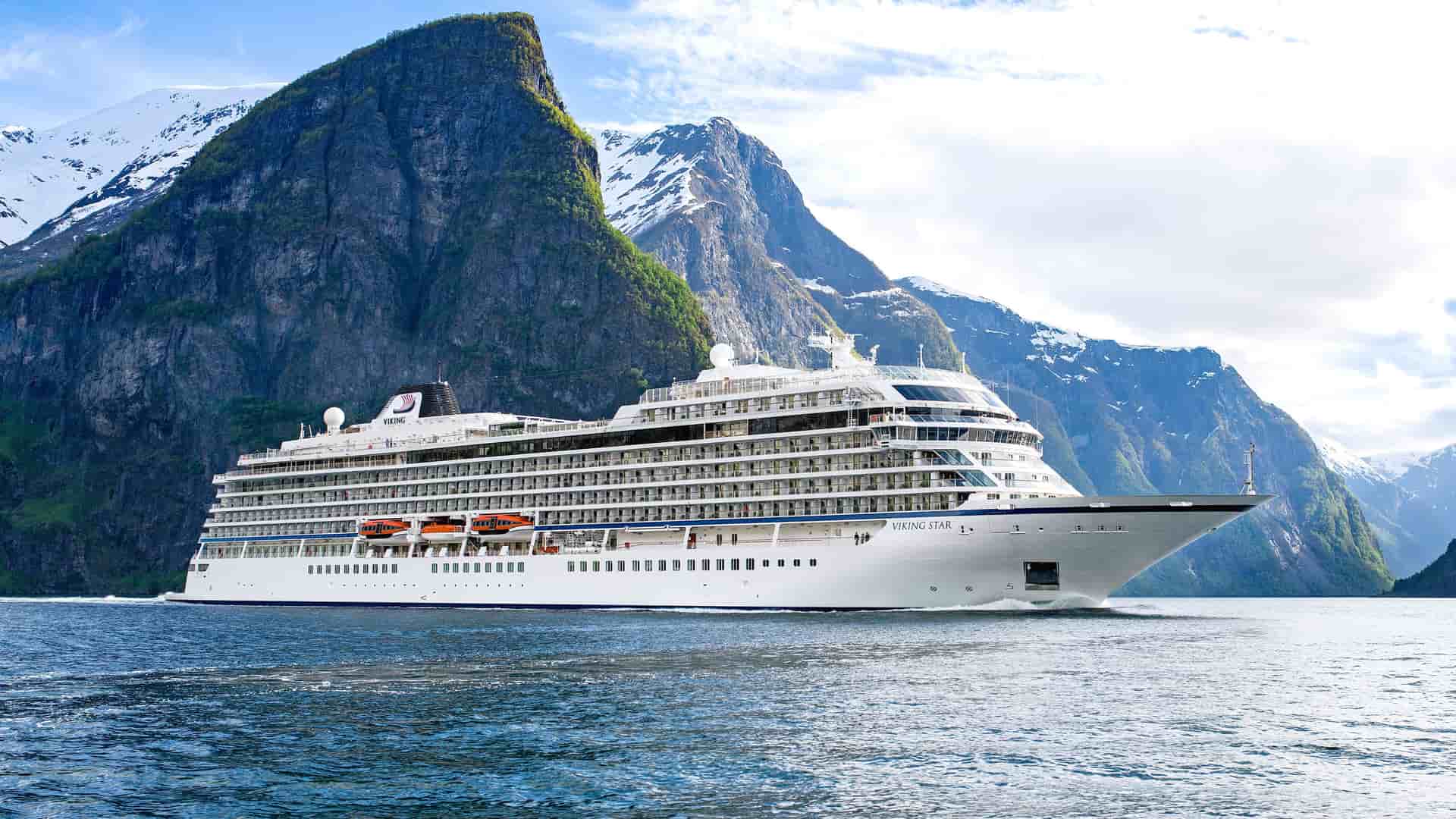 VIking Star at sea with mountains in the background.