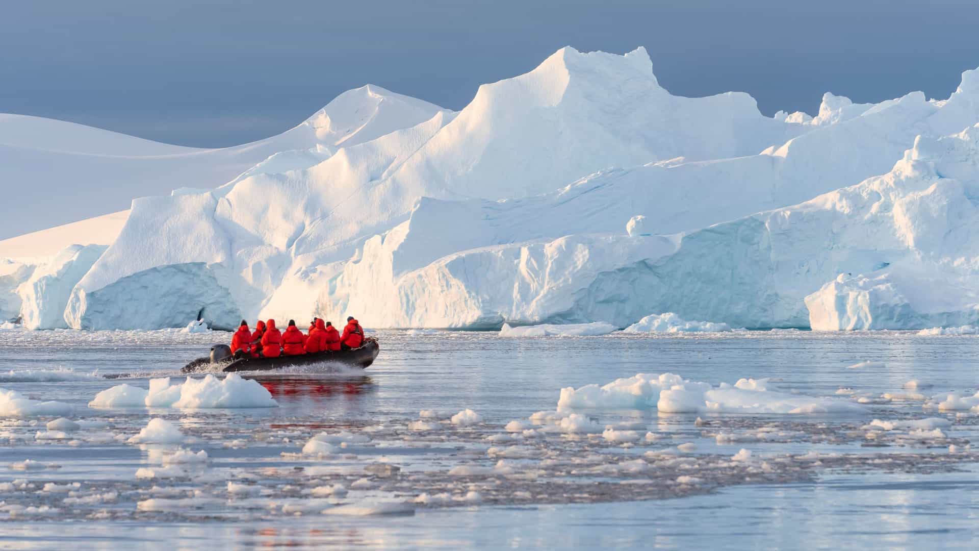 Adventure cruise passengers on a Zodiac excursion in Antarctica.