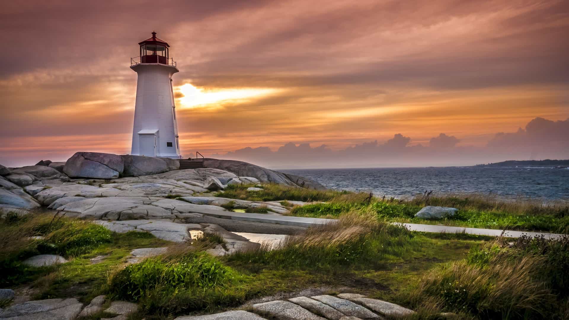 The picturesque Peggy's Cove lighthouse in Nova Scotia, a highlight of Canada & New England itineraries offered by Azamara Cruises.