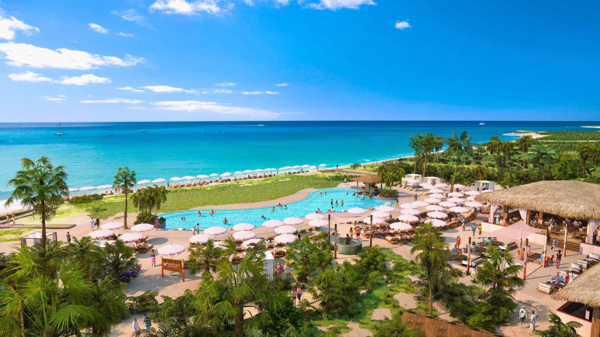 A wide aerial view of Pearl Cove at Carnival's new private destination, Celebration Key, in the Bahamas, featuring a large swimming pool, tropical beach with lounge chairs, and clear turquoise water.