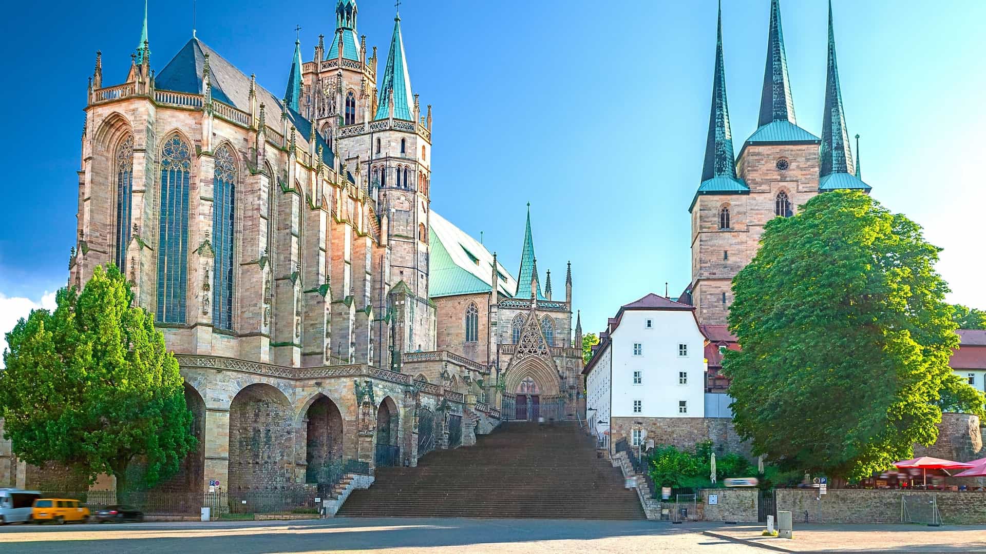 Two towering Gothic churches, St. Mary's Cathedral and St. Severus Church, overlook Erfurt's vast Domplatz in Germany.