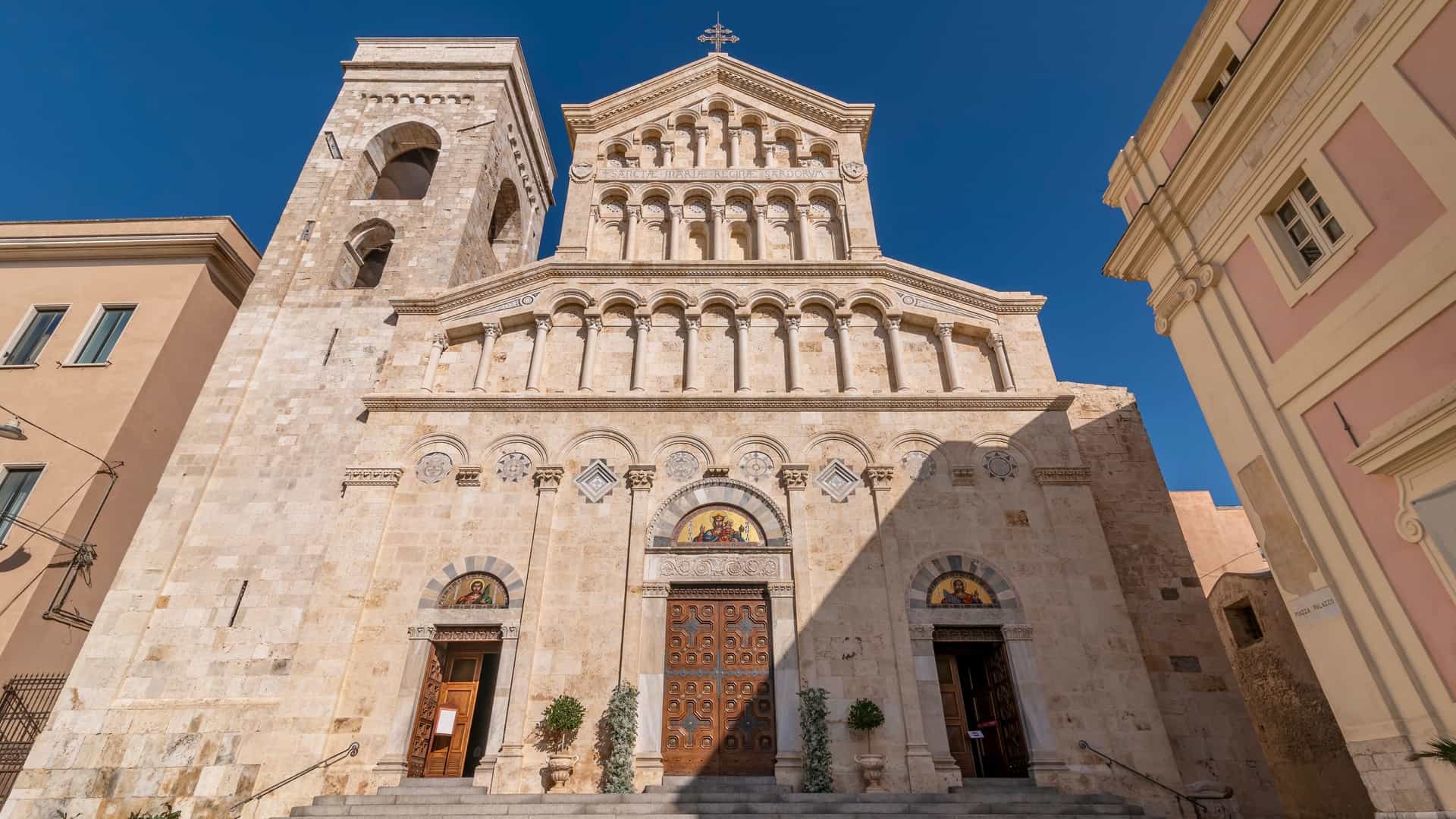 The Cathedral of Santa Maria Assunta and Santa Cecilia (Duomo di Cagliari) in Cagliari, Sardinia, Italy, showcasing its ornate façade, dome, and bell tower, dominating the city's Castello district.