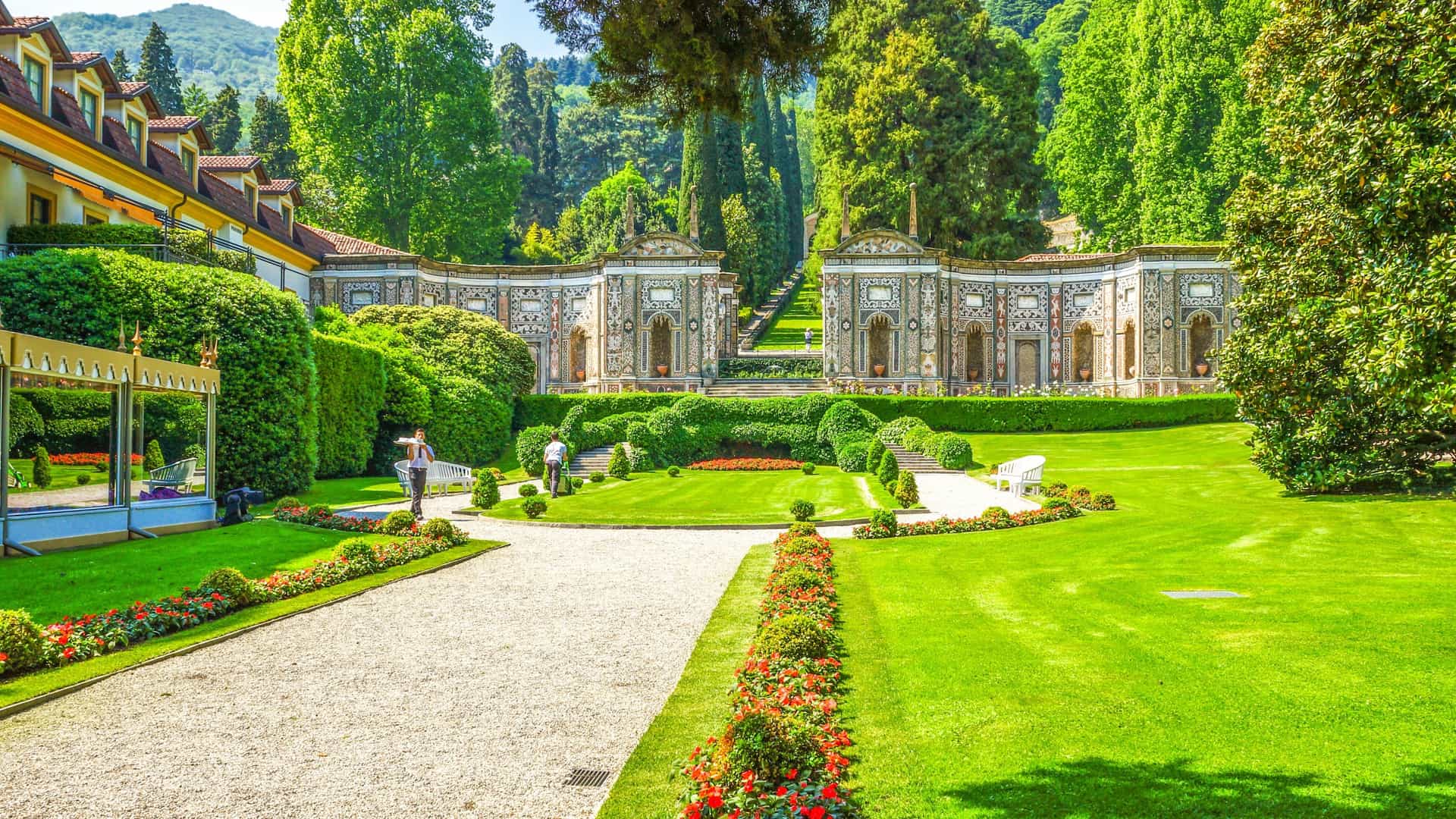  The historic Villa d'Este, a Renaissance residence and luxury hotel, situated on the shores of Lake Como, Italy, with its formal gardens, the lake, and mountains visible.