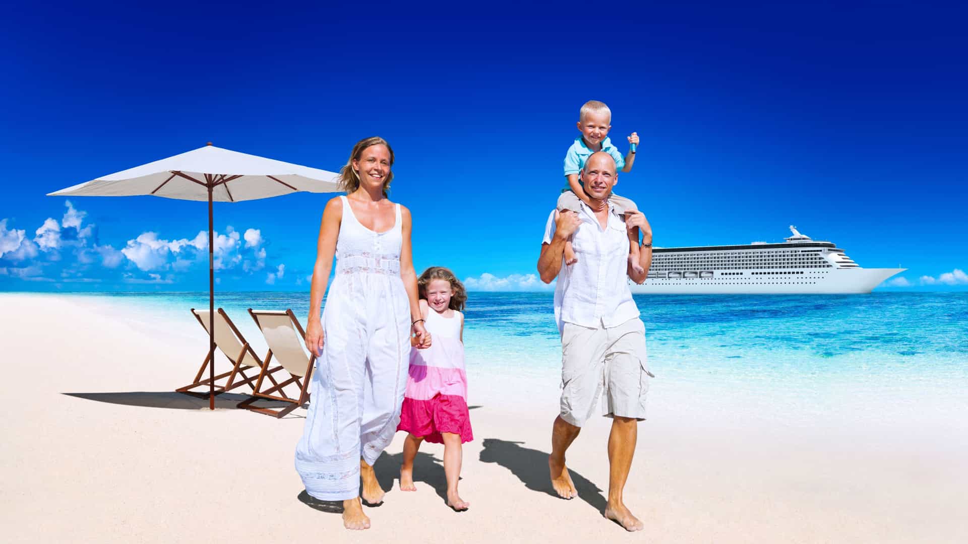 A family walking on the beach with a cruise ship in the background.