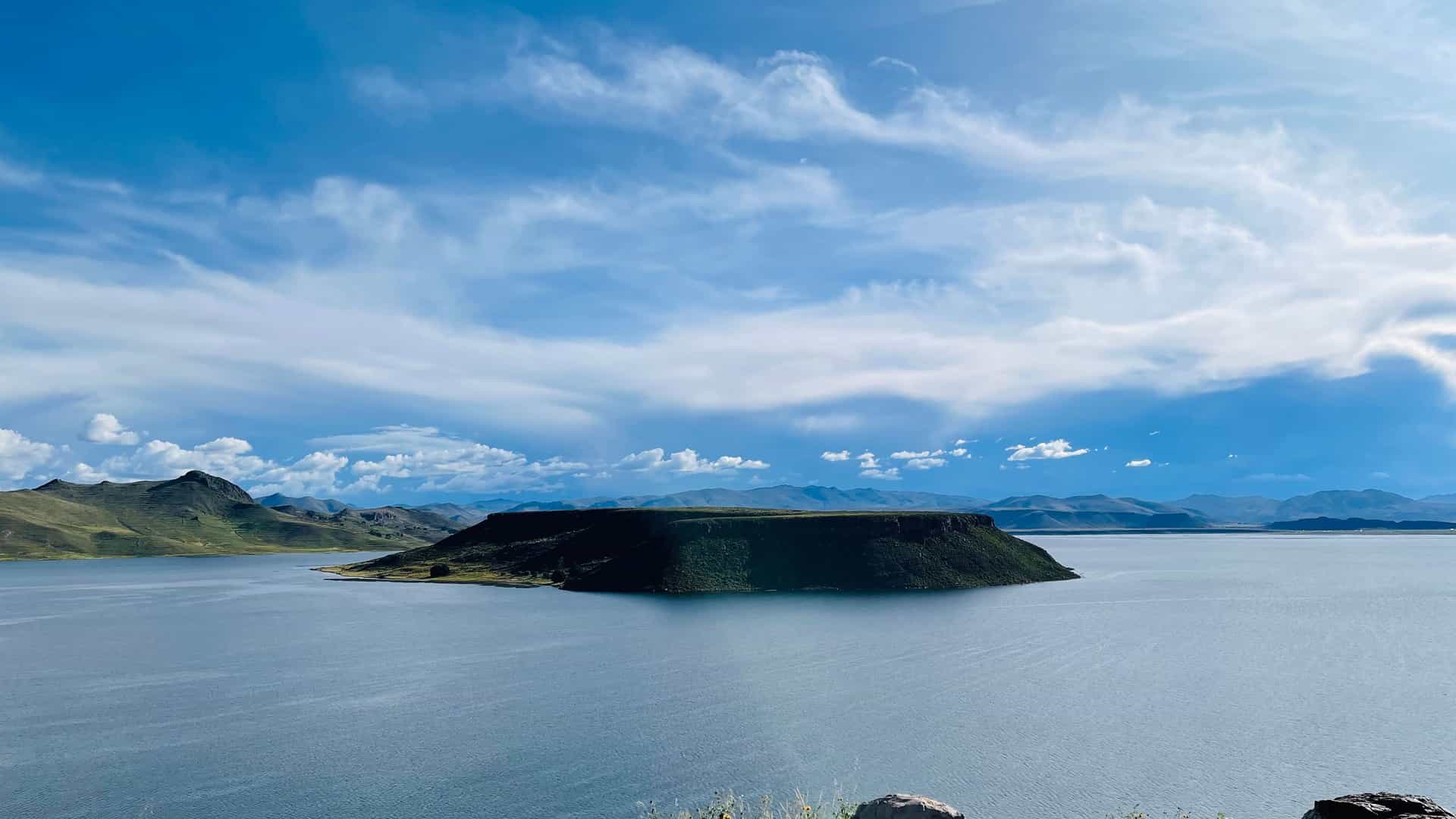 "A stunning wide shot of the volcanic island of Inka T'aqana, or ""Inca's staircase"", in the center of Lake Titicaca near Juliaca, Peru.  "