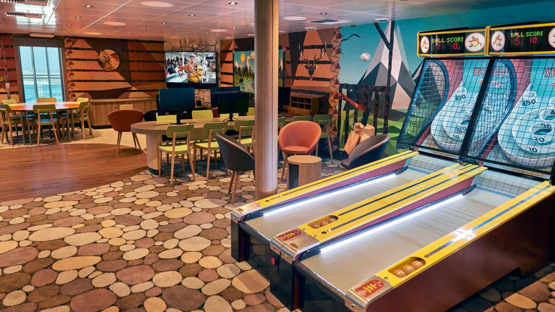 The Lodge teen lounge on a Princess Cruises ship, showing the indoor recreation space with arcade games, seating, and a cabin-themed mural.