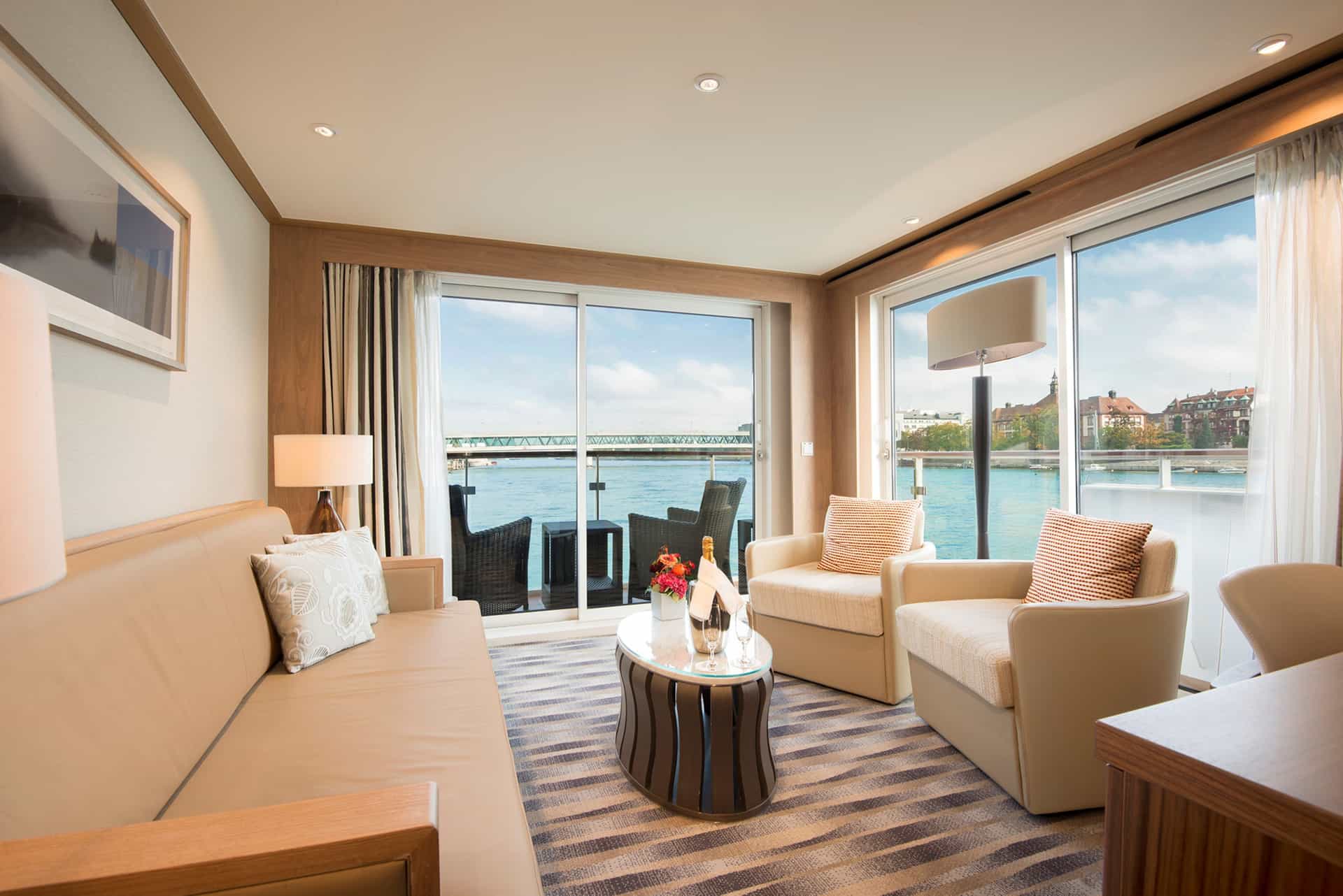 Sunlit wide angle view of the sitting room in the explorer suit on a Viking River ship.