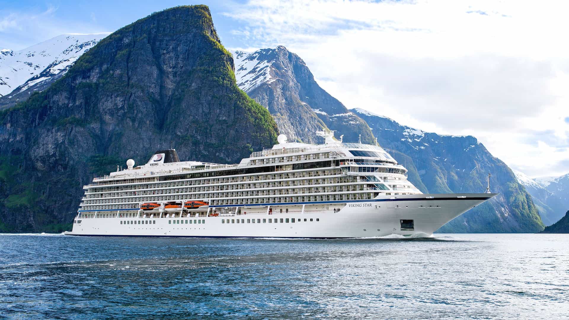 VIking Star at sea with mountains in the background.