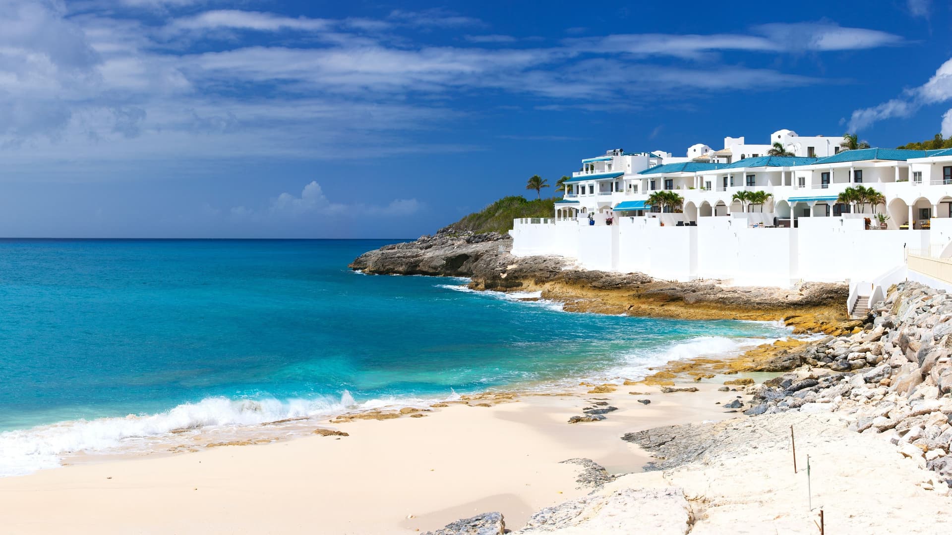 Cupecoy Beach with white resort buildings, St. Maarten.