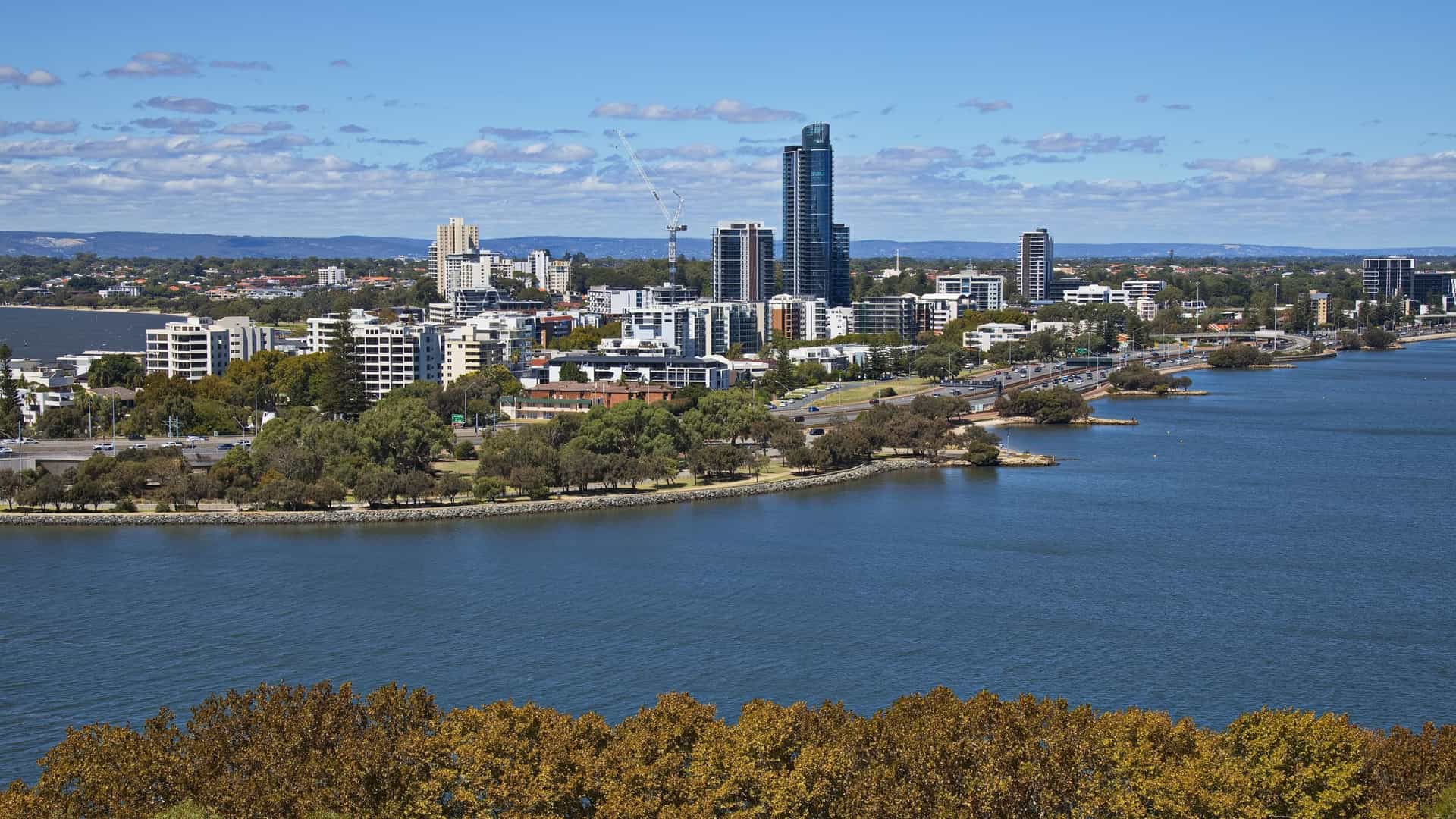 A view of Perth's city skyline and the Swan River from Kings Park and Botanic Garden. The park, a mix of grassed areas, gardens, and native bushland, is one of the largest inner city parks in the world and offers panoramic views from its location on Mount Eliza.