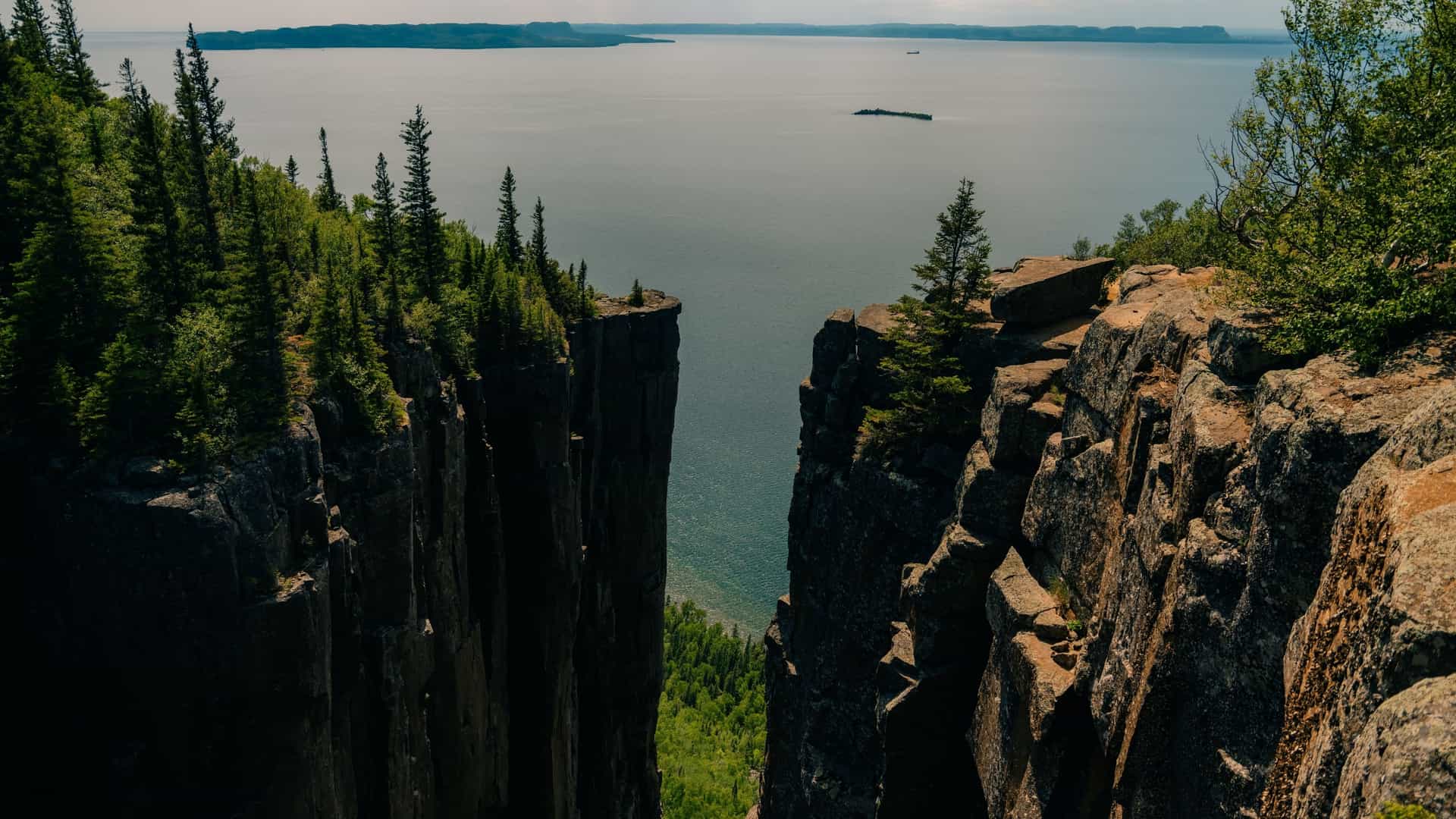 A close up view of the unique vertical "Elevator Rock Formations" composed of dark diabase rock columns, found at the top of the cliffs in Sleeping Giant Provincial Park, Northern Ontario.