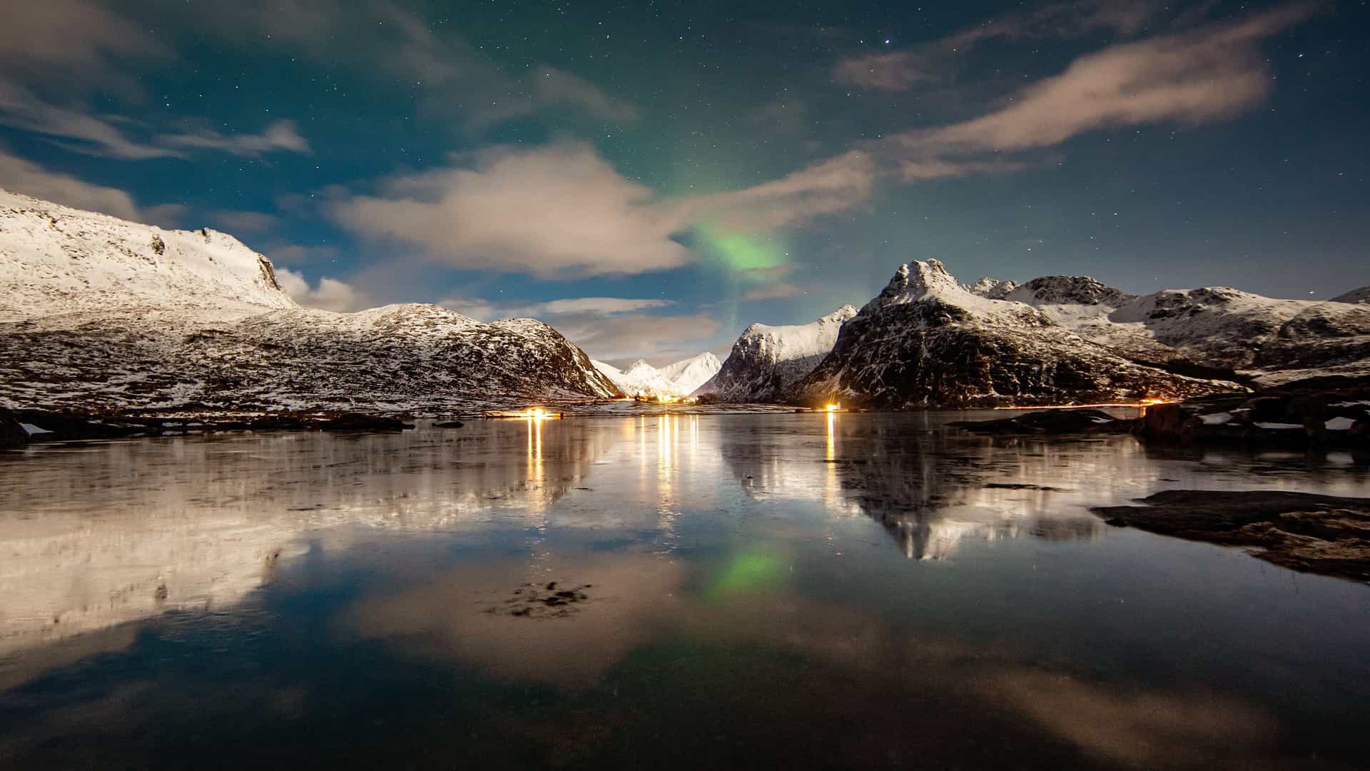 Breathtaking Arctic scenery and aurora borealis over the Lofoten Islands on a Holland America cruise.