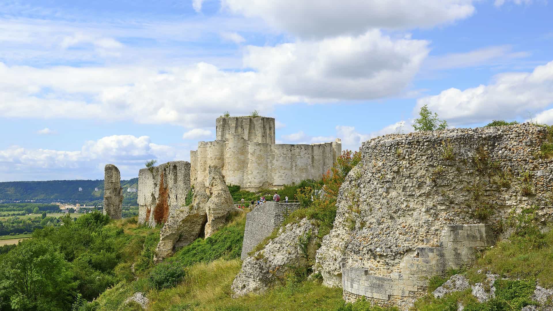 The impressive medieval ruins of Château Gaillard, built by Richard the Lionheart, standing majestically on a cliff overlooking the beautiful Les Andelys countryside.