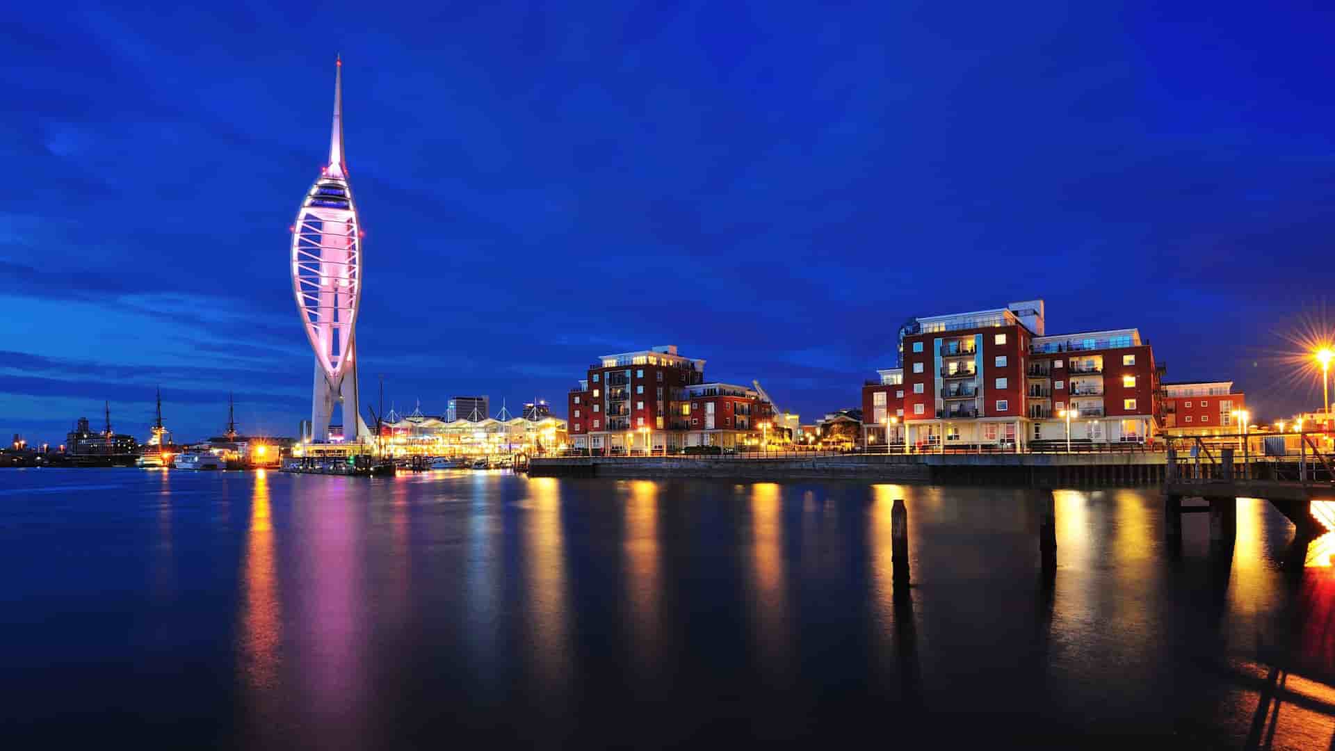 Portsmouth, England night skyline with illuminated Spinnaker Tower.