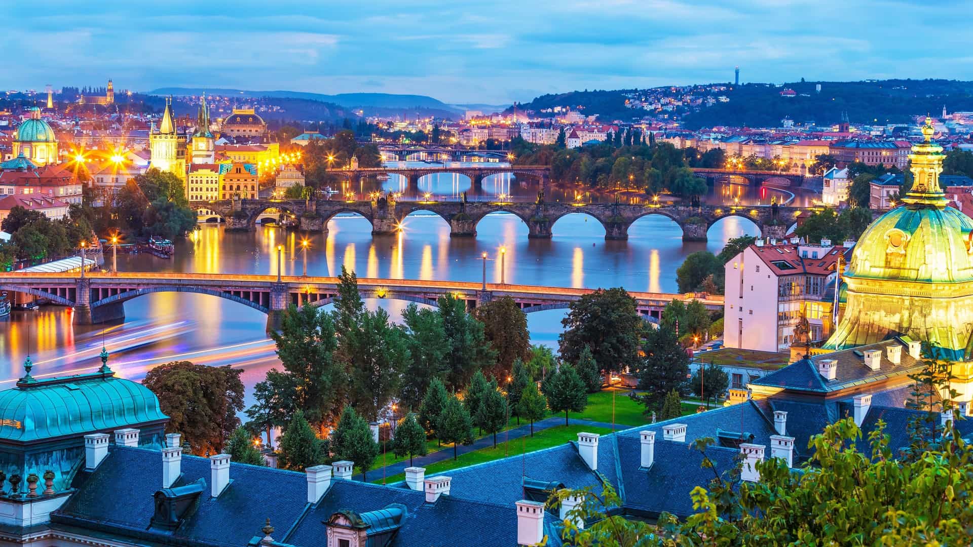 Charles Bridge and Prague Castle at dusk.