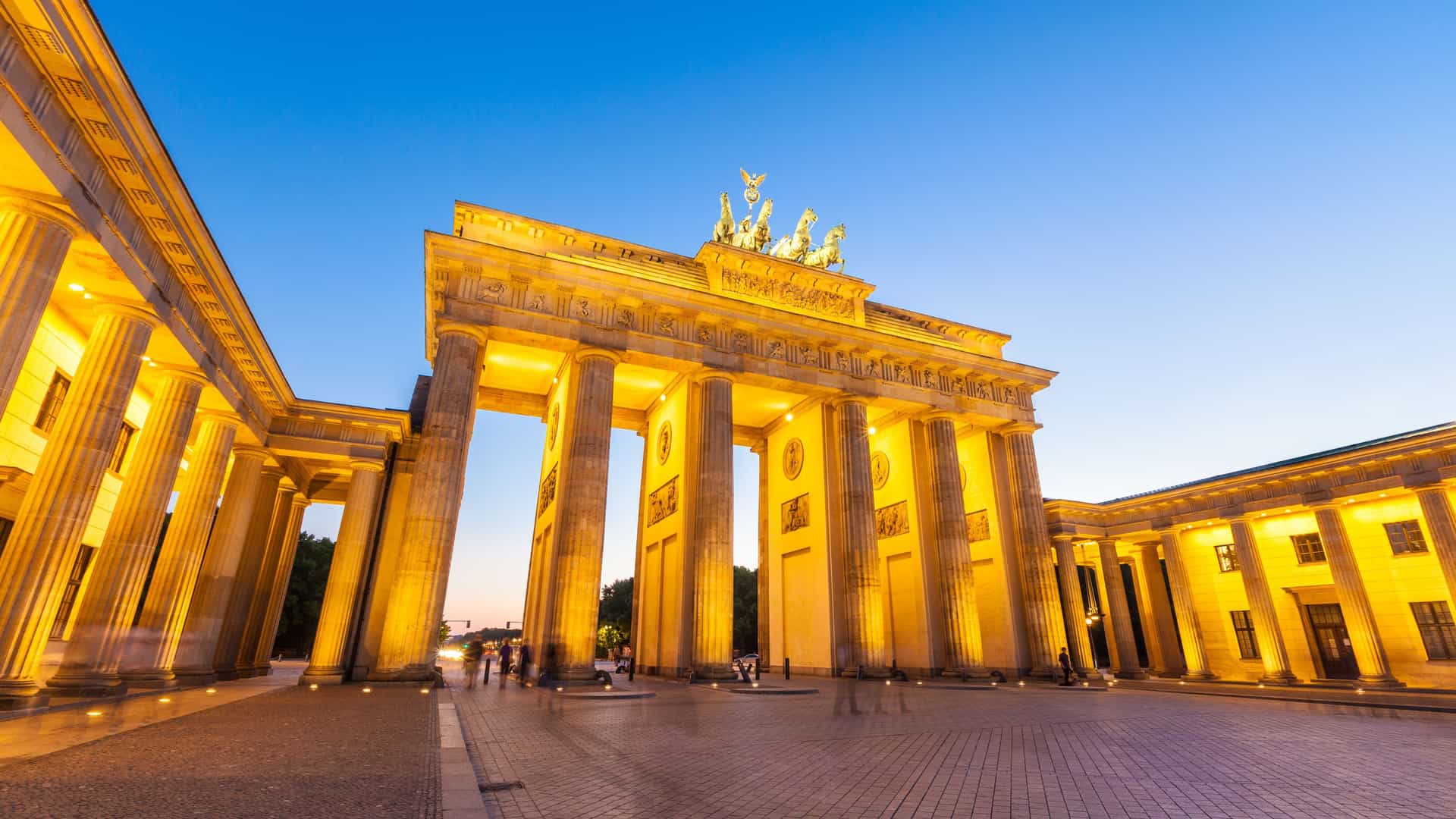 The iconic Brandenburg Gate in Berlin, Germany, beautifully illuminated at dusk, representing the historic European cities explored on Princess Cruises' European itineraries.