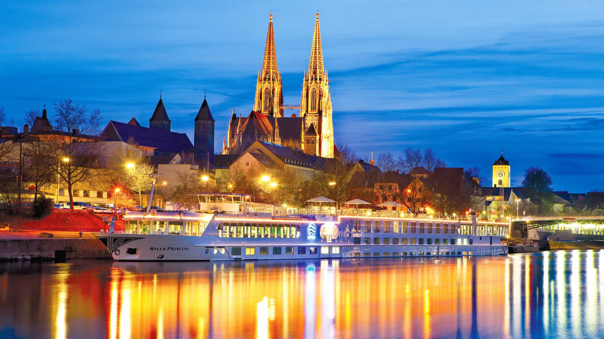 Uniworld's River Princess sailing at night.