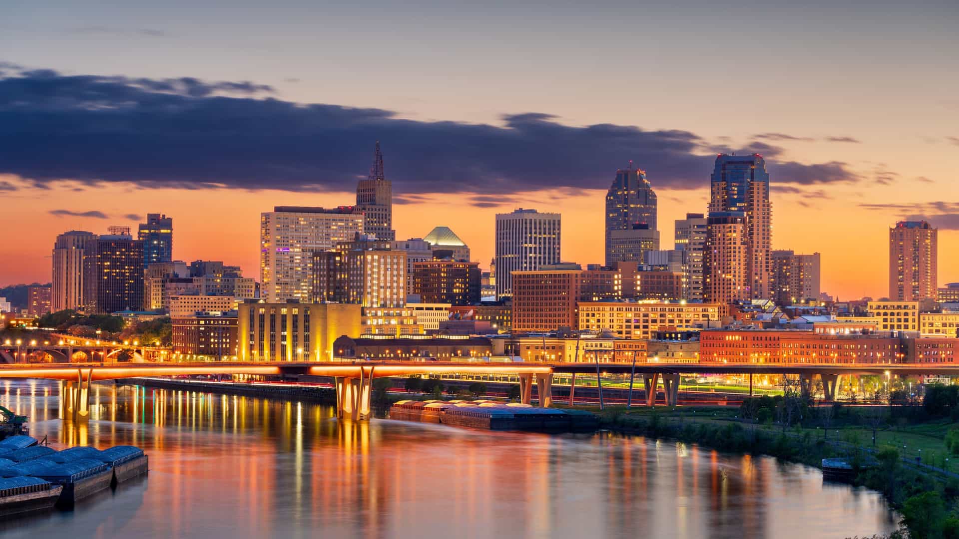 Twilight view of downtown Saint Paul, Minnesota, with the Mississippi River and city lights—an iconic stop on Viking River Cruises' U.S. Rivers & Great Lakes itinerary.