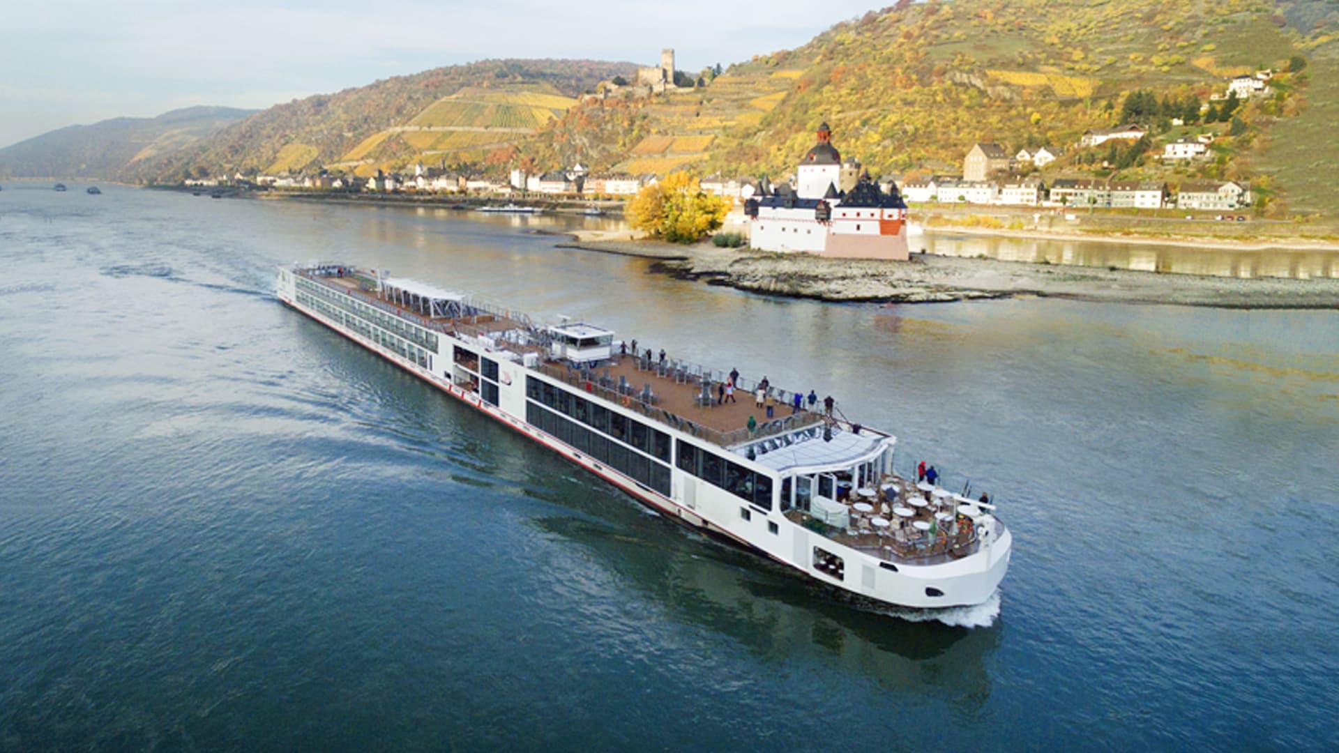 Viking Sigrun sailing with a castle in the background.
