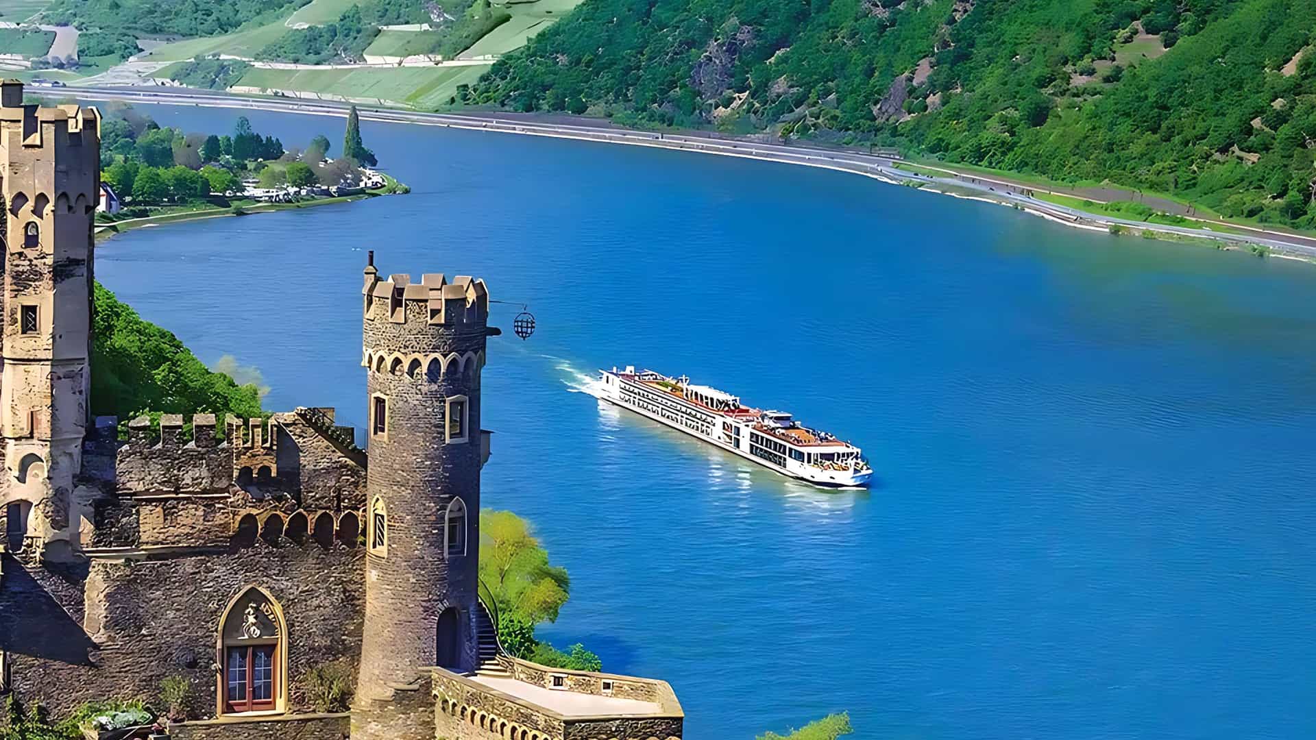 Viking Tor sailing a European river with a castle in the foreground.